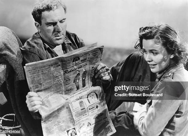 American actors William Bendix and Mary Anderson on the set of Lifeboat, written by John Steinbeck and directed and produced by British Alfred...