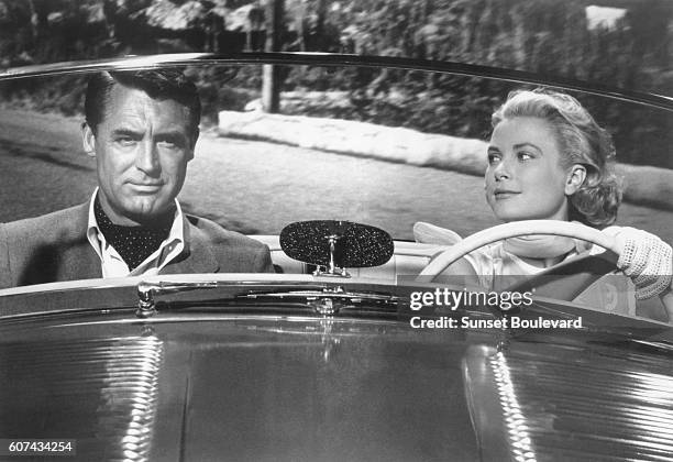 American actors Cary Grant and Grace Kelly on the set of To Catch a Thief, directed and produced by British Alfred Hitchcock.