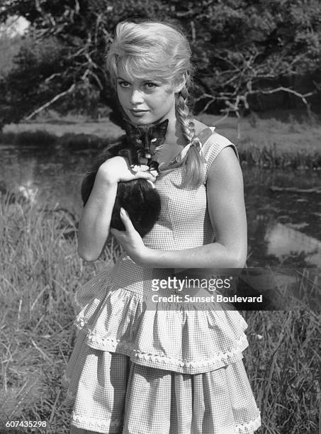French actress Brigitte Bardot on the set of La Mariee est Trop Belle , directed by Pierre Gaspard-Huit.