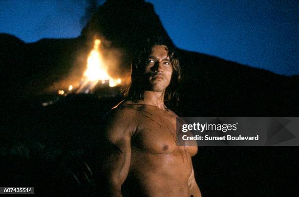 Austrian-born American actor Arnold Schwarzenegger on the set of Conan the Barbarian, directed by John Milius.