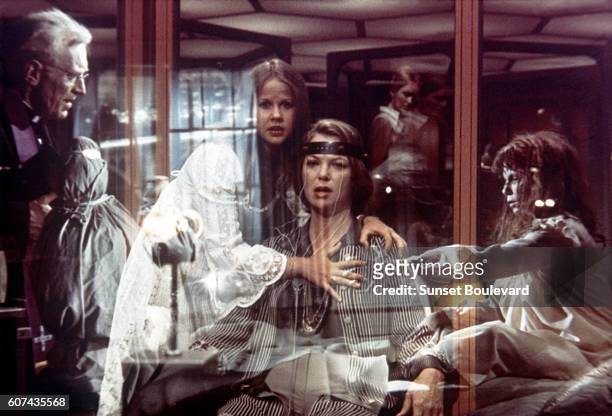 Swedish actor Max von Sydow, American actresses Linda Blair and Louise Fletcher on the set of Exorcist II: The Heretic, directed by John Boorman.