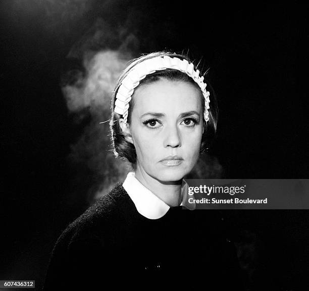 French actress Jeanne Moreau on the set of Le Journal d'une Femme de Chambre, based on the novel by Octave Mirbeau, and directed by Luis Buñuel.