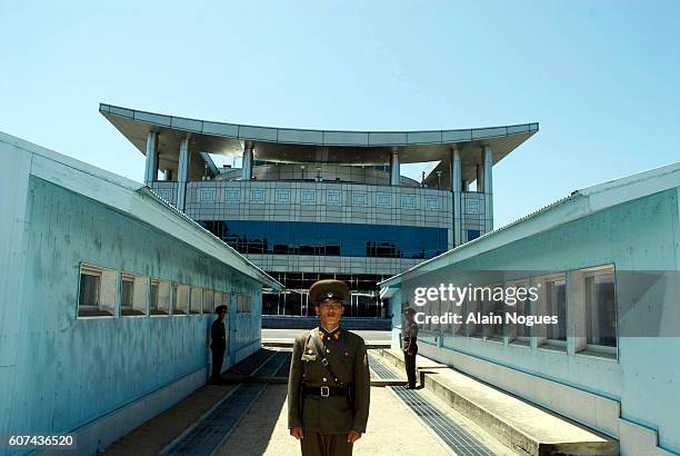 North Korean soldiers on duty on the Military Demarcation Line separating North and South Korea since 1953. The line is called the Hyujeonseon in...