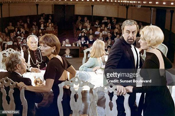 French actresses Stephane Audran and Delphine Seyrig with Spanish actor Fernando Rey on the set of Le Charme Discret de la Bourgeoisie, directed by...