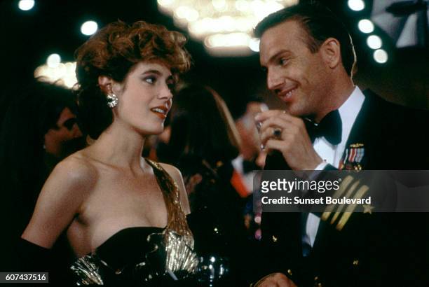 American actors Sean Young and Kevin Costner on the set of No Way Out, based on the novel by Kenneth Fearing, and directed by Roger Donaldson.