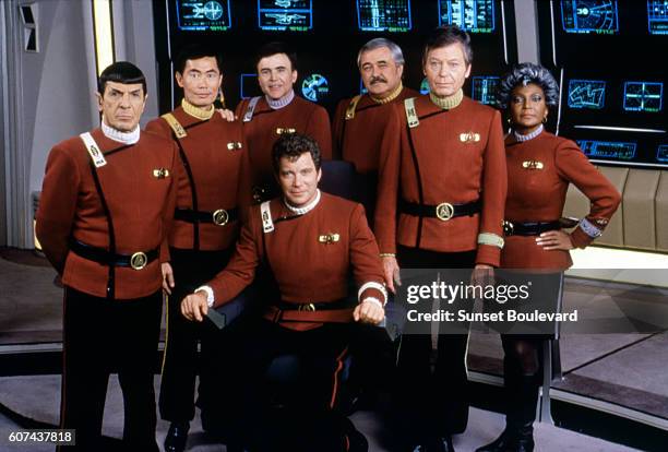 American actors Leonard Nimoy, George Takei, Walter Koenig, DeForest Kelley, Nichelle Nichols, and Canadian William Shatner on the set of Star Trek...