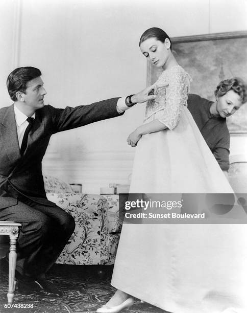 British actress Audrey Hepburn with French fashion designer Hubert de Givenchy in his workshop, in Paris.