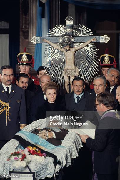 Isabelita Peron , the new President of the Republic of Argentina, near the body of her late husband, former President Juan Peron.