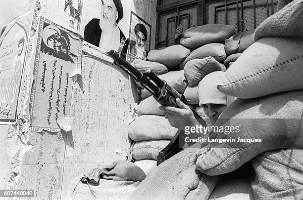 Sunni Mourabioun soldier holds her position in Beirut, Lebanon, shortly before the 1984 withdrawal of the Multinational Forces. In 1975, Lebanon fell...