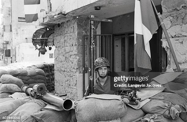 French soldiers, members of the coalition Multinational Force, stand guard in Beirut, Lebanon, as peace negotiations take place at the 1984 National...