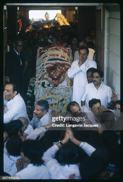 The body of Indira Gandhi lies in state following her assassination on October 31 surrounded by mourners, including her son Rajiv Gandhi. Indira...