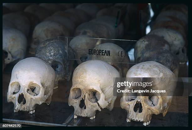 Human skulls originating from mass graves with annotations, at the former genocide center of Choeung Ek, used by Khmer Rouges under the Polpot plan...