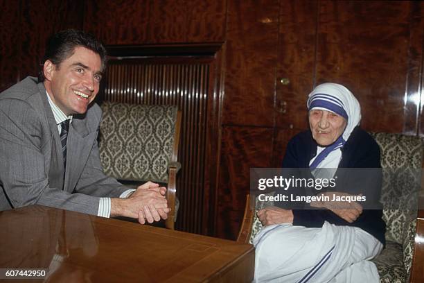 Romanian Prime Minister Petre Roman greets Mother Teresa in Bucharest. Prime Minister Roman, founding member of the National Salvation Front, came...