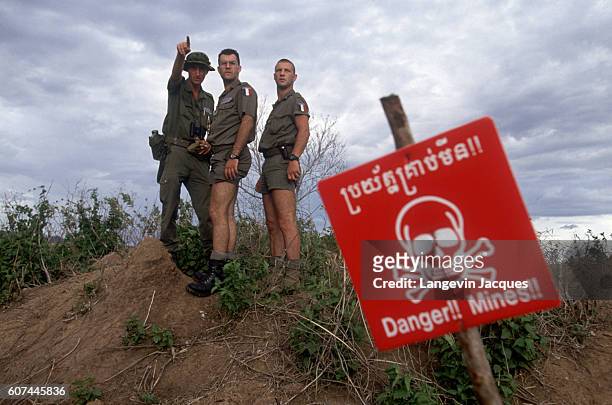 French soldiers of the Foreign Legion, intervening through a United Nations mandate, teach mine clearing techniques to Cambodian governmental forces....