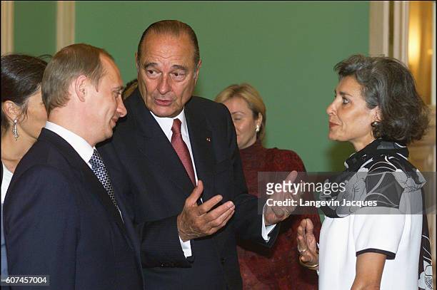 President J. Chirac presents Claudie Andre-Deshays to Vladimir Putin the Russian President at the official dinner held in the Kremlin in honor of the...