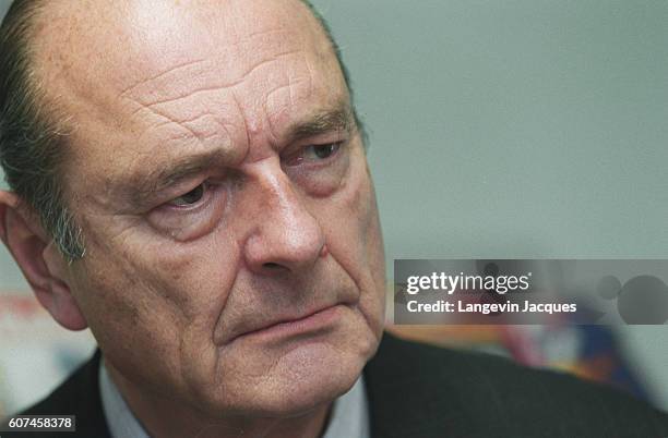 French President Jacques Chirac looks serious after officially declaring his candidacy for the 2002 presidential elections. He was re-elected by the...