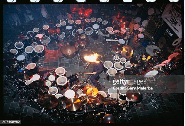 Chad Smith of the Red Hot Chili Peppers plays the world's largest drum set with flames shooting from the top of his hat.