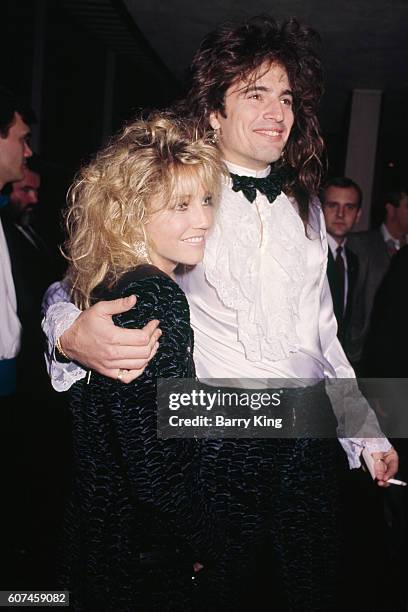 American actress Heather Locklear and her husband, drummer of glam metal band Motley Crue, Tommy Lee, attend the 44th Golden Globe Awards ceremony,...