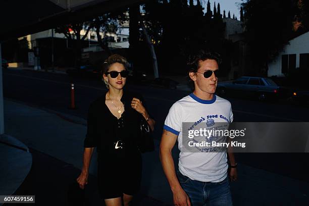 American pop singer, songwriter, and actress Madonna and her husband, actor Sean Penn.