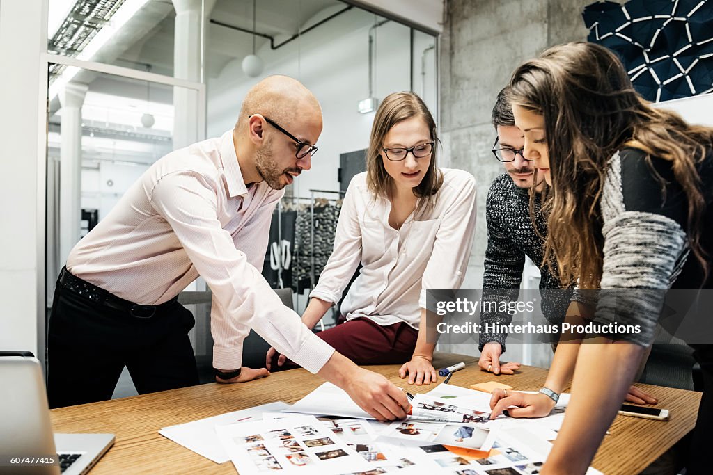 Team during business meeting discussing