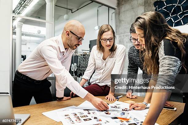 team during business meeting discussing - sharing ideas stock pictures, royalty-free photos & images