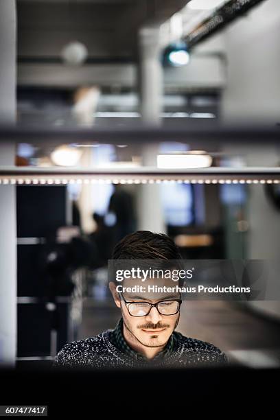 young businessman working late in office - vertical screen stock pictures, royalty-free photos & images