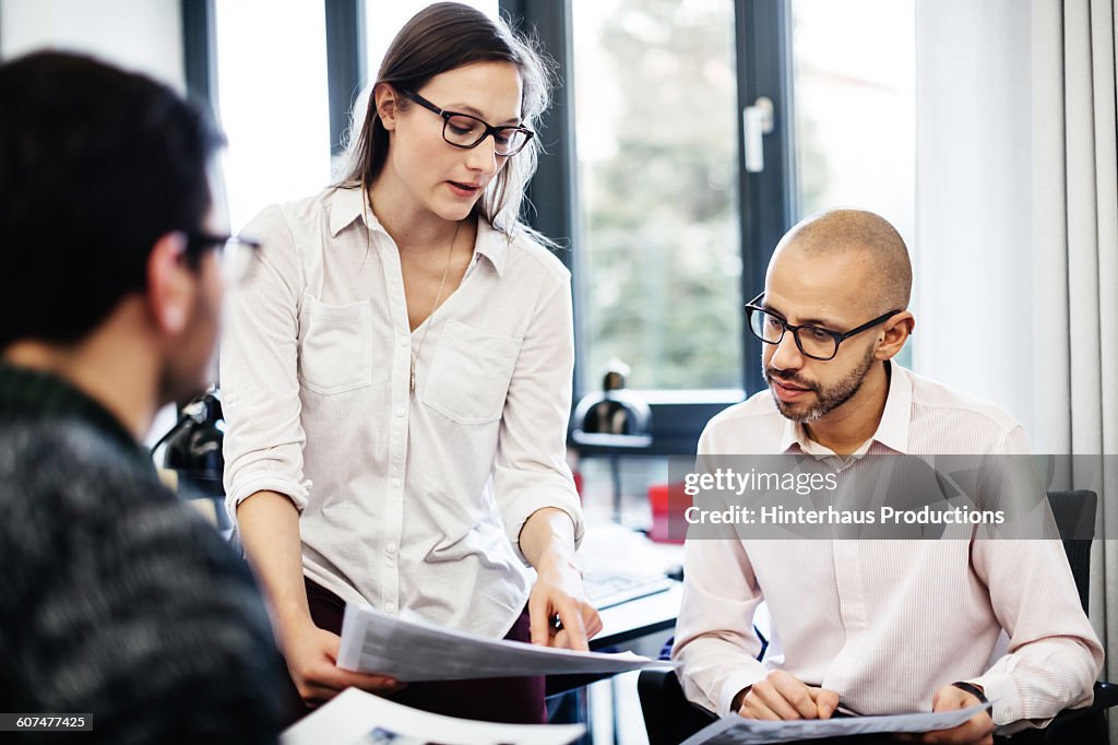 Lady Explaining Something Woman Explaining Something To Her Colleagues High-Res Stock Photo ...