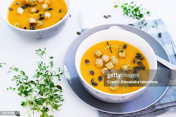 pumpkin soup served with croutons and pumpkin seeds - pumpkin soup stock pictures, royalty-free photos & images