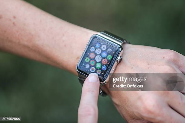 apple watch home screen with raindrop on screen - waterproofing stock pictures, royalty-free photos & images