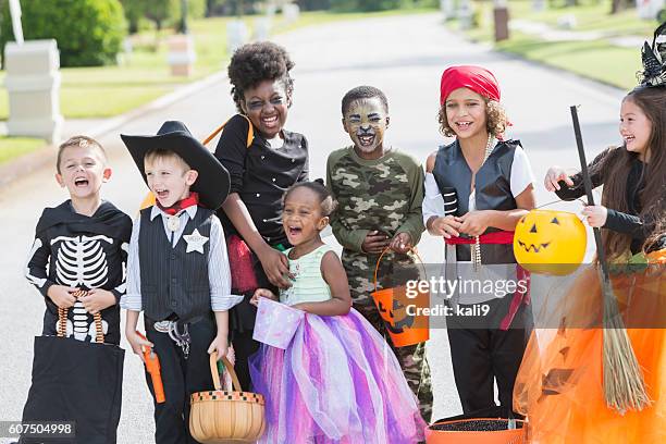 multi-ethnic group of children in halloween costumes - princess pirates stock pictures, royalty-free photos & images