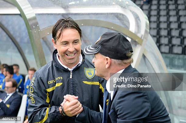 Christian Maraner assistant coach of AC ChievoVerona shakes hands with Head coach of Udinese Giuseppe Iachini during the Serie A match between...