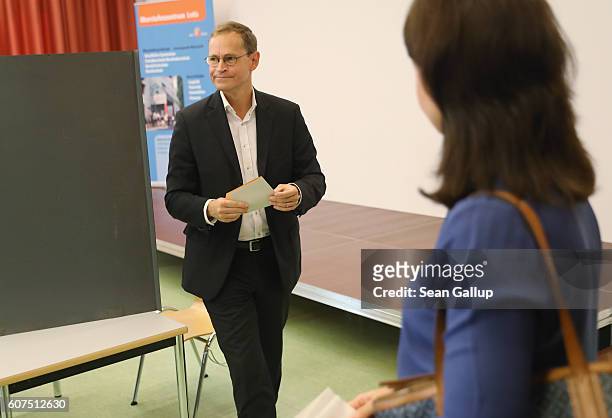 Berlin Mayor and German Social Democrat Michael Mueller prepares to cast his ballot in Berlin state elections on September 18, 2016 in Berlin,...