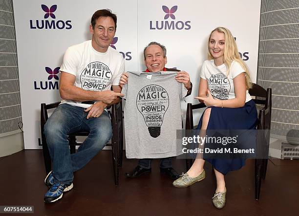 Jason Isaacs,Warwick Davis and Evanna Lynch supporting the Lumos launch of its 'Be the Light' T-shirt to raise funds for its work to help end the...