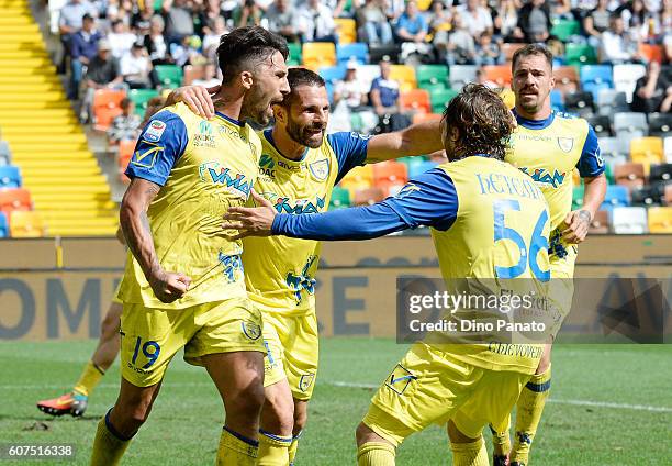 Lucas Castro of AC ChievoVerona celebrates with his team mate's after scoring his team's first goal during the Serie A match between Udinese Calcio...