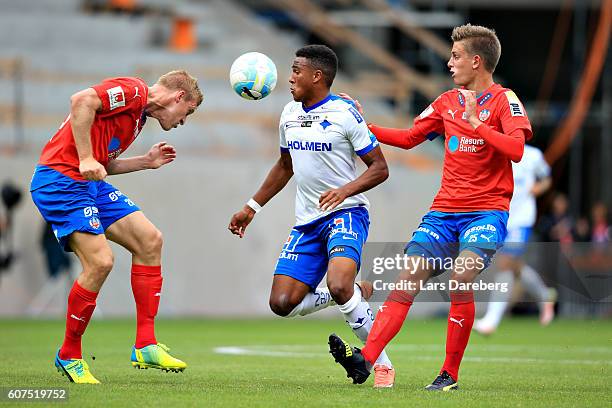 Peter Larsson of Helsingborgs IF and Tesfaldet Tekie of IFK Norrkoping and Felix Bindelov of Helsingborgs IF during the Allsvenskan match between...