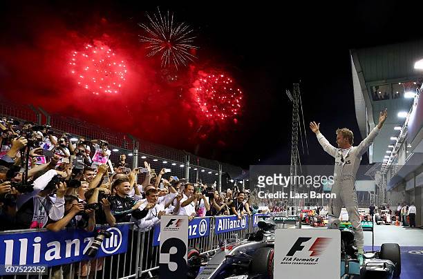 Nico Rosberg of Germany and Mercedes GP celebrates his win in parc ferme during the Formula One Grand Prix of Singapore at Marina Bay Street Circuit...