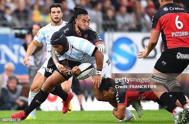 Toulon's centre Ma'a Nonu of New Zealand vies with Racing 92's prop Ben Tameifuna of New Zealand during the French Top 14 rugby union match between...