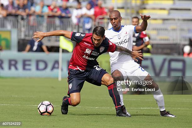 Marco Boriello of Cagliari competes for the ball with Abdoulay Konko of Atalanta during the Serie A match between Cagliari Calcio and Atalanta BC at...