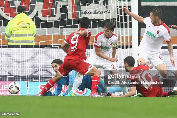 OYoshinori Muto of Mainz scores the 3rd team goal during the Bundesliga match between FC Augsburg and 1. FSV Mainz 05 at WWK Arena on September 18,...