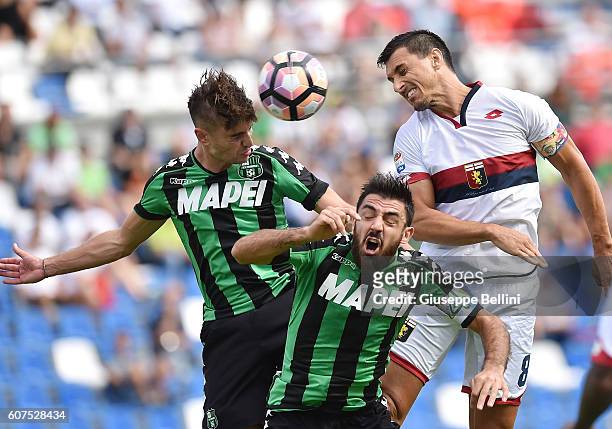 Luca Antei and Francesco Magnanelli of US Sassuolo and Nicolas Burdisso of Genoa CFC in action during the Serie A match between US Sassuolo and Genoa...