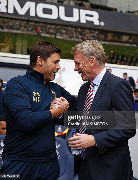 Tottenham Hotspur's Argentinian head coach Mauricio Pochettino greets Sunderland's Scottish manager David Moyes ahead of the English Premier League...