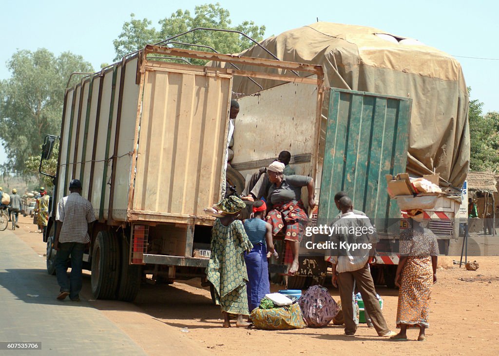 Africa, Burkina Faso, View Of Bus Stop, Passengers Entering Steel Shipping Cargo Container (Year 2007)