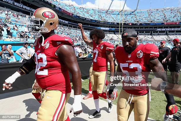 Colin Kaepernick of the San Francisco 49ers walks to the locker room prior to their game against the Carolina Panthers at Bank of America Stadium on...