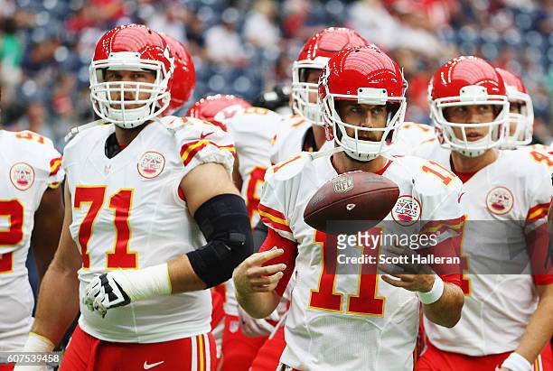 Alex Smith of the Kansas City Chiefs waits with his teammates on the field prior to the start of their game against the Houston Texans at NRG Stadium...