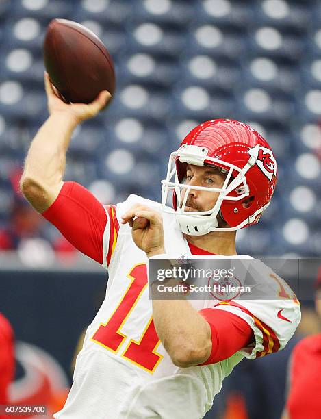 Alex Smith of the Kansas City Chiefs works out on the field prior to the start of their game against the Houston Texans at NRG Stadium on September...