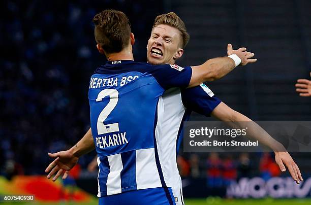 Mitchell Weiser of Hertha BSC celebrates after scoring his team's first goal during the Bundesliga match between Hertha BSC and FC Schalke 04 at...