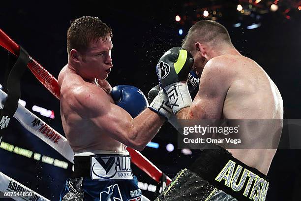 Canelo Alvarez, left, fights with Liam Smith, right, during the Canelo v Smith - WBO Middleweight World Championship Fight at AT&T Stadium on...