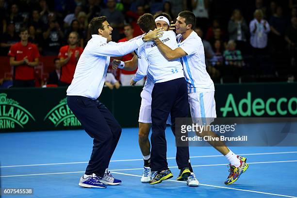 Leonardo Mayer of Argentina celebrates with his team-mates, Juan Martin del Potro, Guido Pella and Federico Delbonis, after winning his singles match...