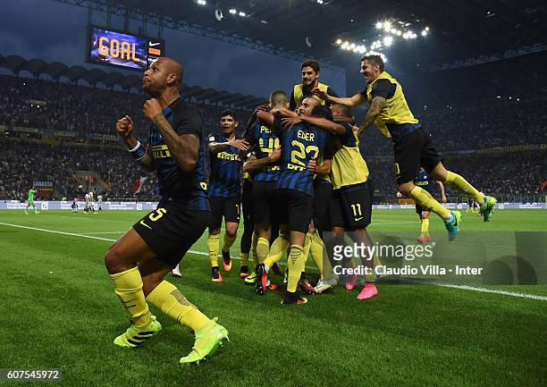 Ivan Perisic of FC Internazionale celebrates with team-mates and Felipe Melo after scoring the goal during the Serie A match between FC...