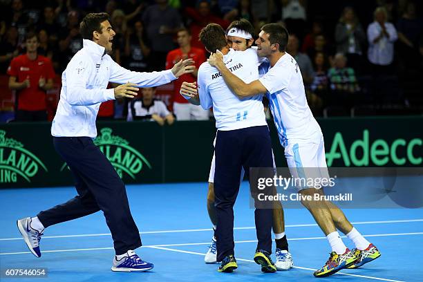 Leonardo Mayer of Argentina celebrates with his team-mates, Juan Martin del Potro, Guido Pella and Federico Delbonis, after winning his singles match...